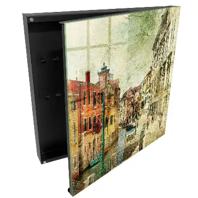 Cuier de perete pentru chei cu design de case colorate lângă canal