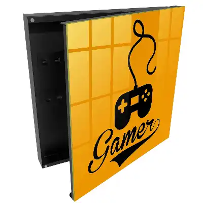 Suport de perete pentru chei cu design de controller negru pe fundal portocaliu
