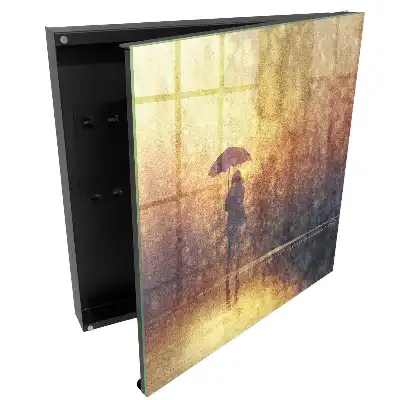 Casetă pentru chei cu design persoană cu umbrelă în lumina apusului