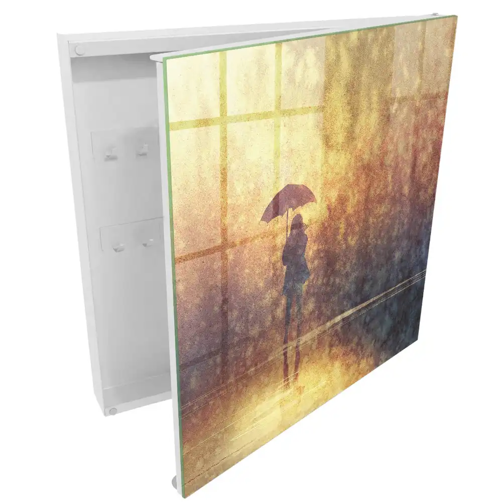 Casetă pentru chei cu design persoană cu umbrelă în lumina apusului