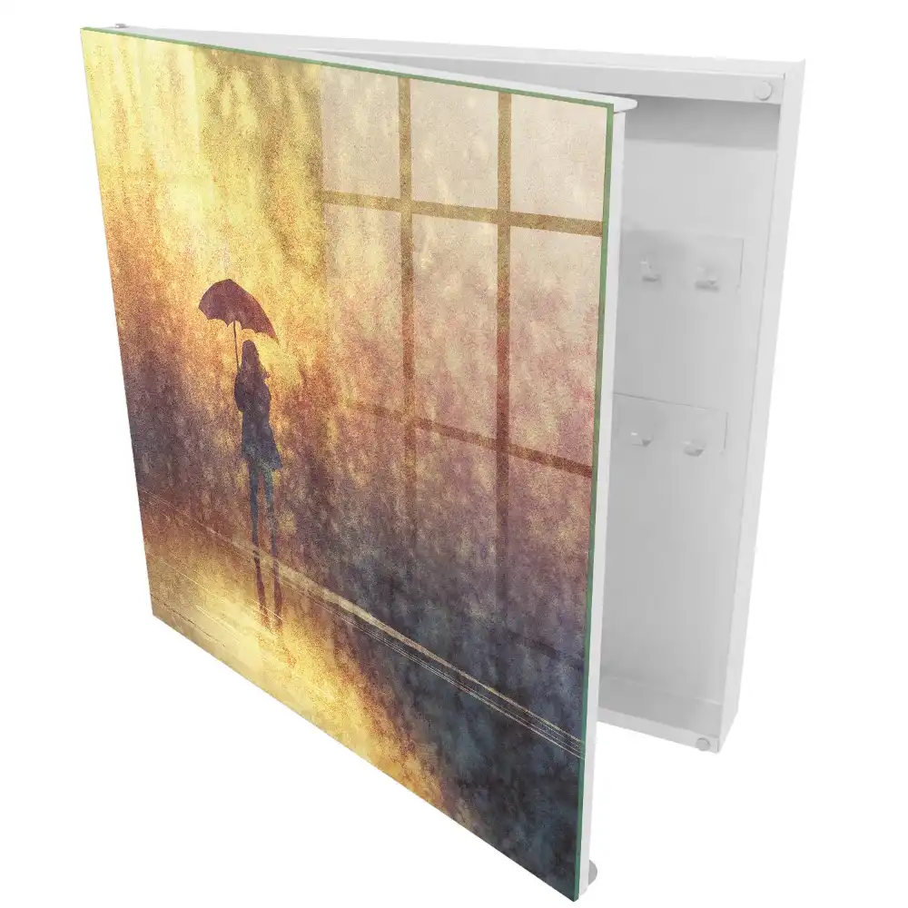 Casetă pentru chei cu design persoană cu umbrelă în lumina apusului