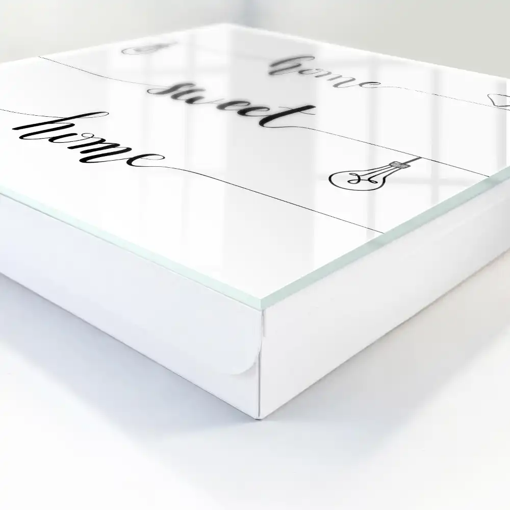 Casetă de chei cu design monocrom și textul „acasă dulce casă”