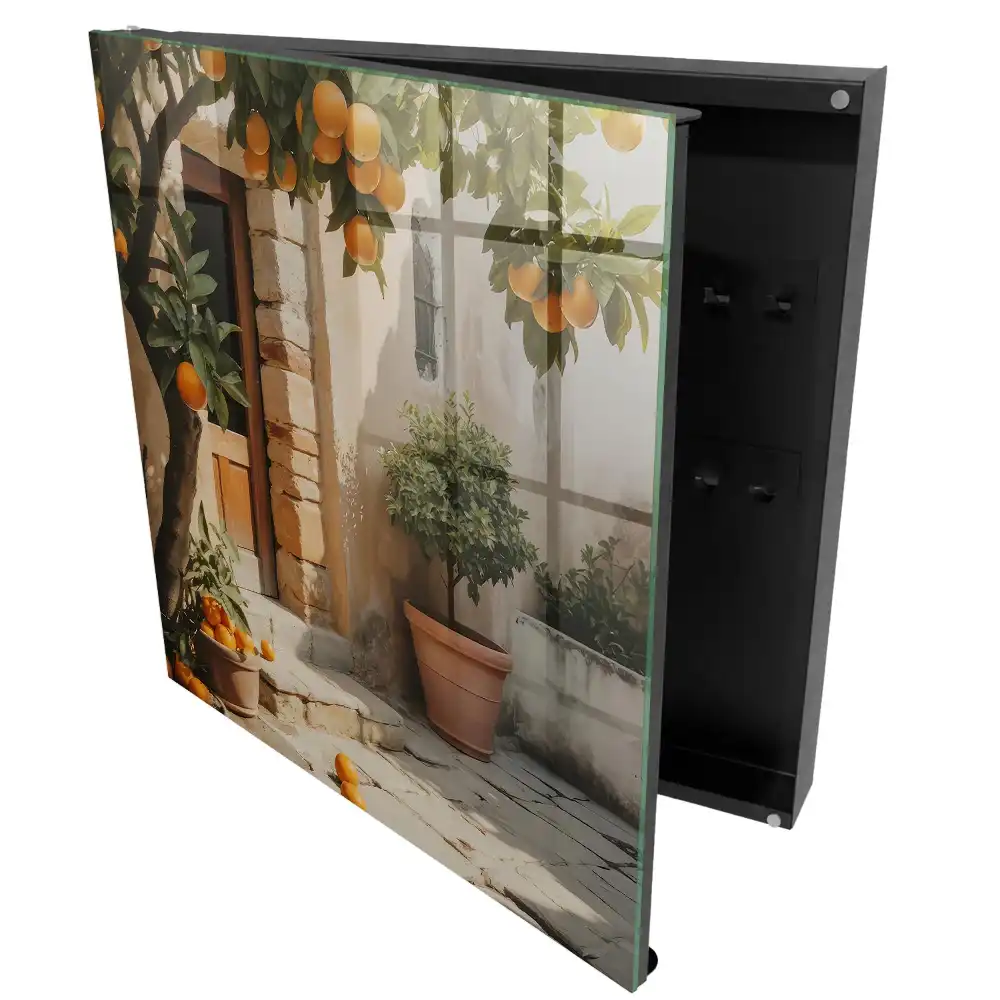 Suport de chei pentru perete cu design de portocal lângă o clădire veche